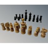 An antique stained wooden chess set, lacking one pawn,