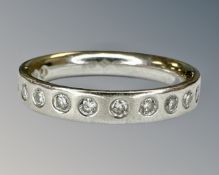 A platinum diamond half eternity ring, size H, 4.2g.