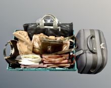 A box containing assorted lady's handbags including Radley etc.