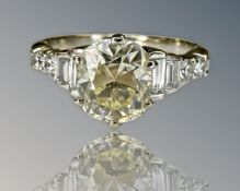 An 18ct yellow gold diamond ring, the central old cut stone approximately 1.
