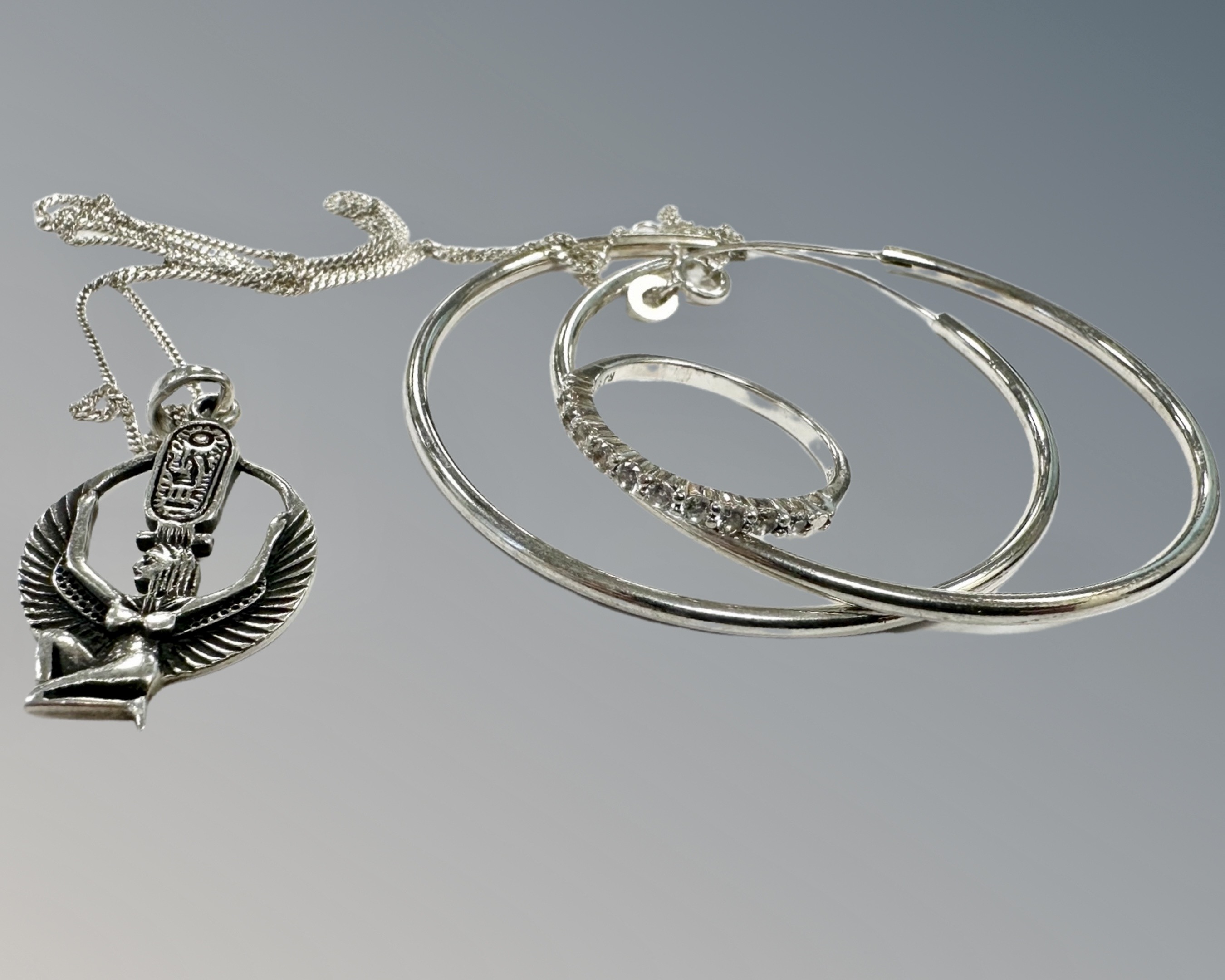 A sterling silver pendant on chain together with sterling silver dress ring and a pair of hoop