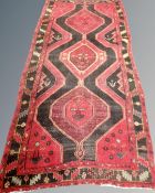 A Kurdish Long Rug, North-West Iran, 295cm by 130cm.