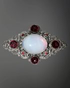 An ornate silver gem-set brooch by Zoltan White & Co, width 75mm.