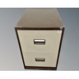 A Triumph two drawer metal filing cabinet.