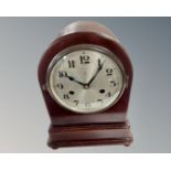 An early 20th century mantel clock with silvered dial.