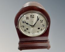 An early 20th century mantel clock with silvered dial.