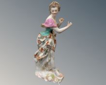 A Derby porcelain figure of a female musician (a/f)