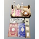 A box containing lead crystal decanters, stoneware hot water bottles, coronation volumes,