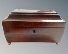 A George III mahogany tea caddy.