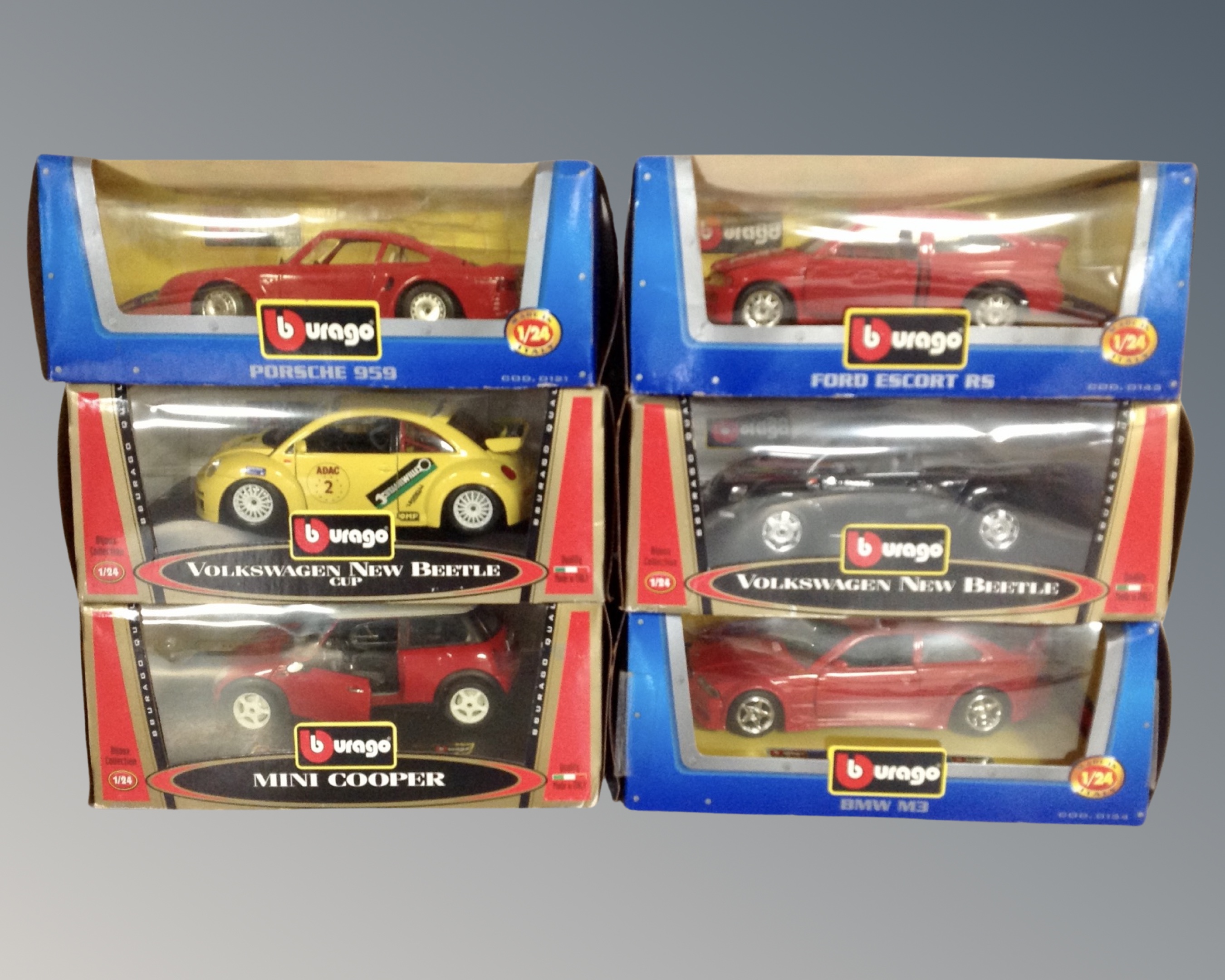 Six Burago 1-24 scale die cast vehicles : Porsche, Ford Escort, VW etc,