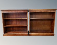 A pair of reproduction mahogany open bookshelves.