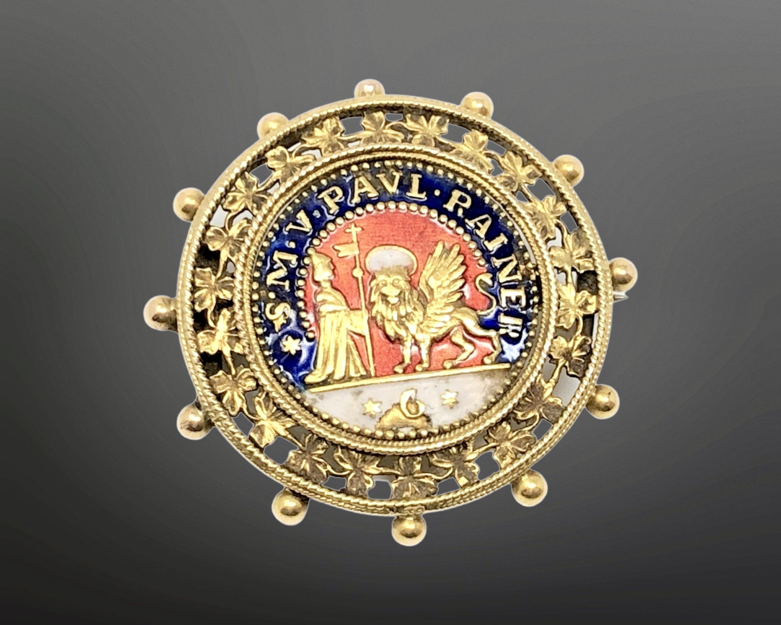 An antique 18ct gold and enamel brooch 'S M V PAUL RAINER', 7.4g, diameter 32 mm.