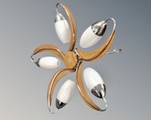 A 1970's plywood and chrome five way light fitting with glass shades.