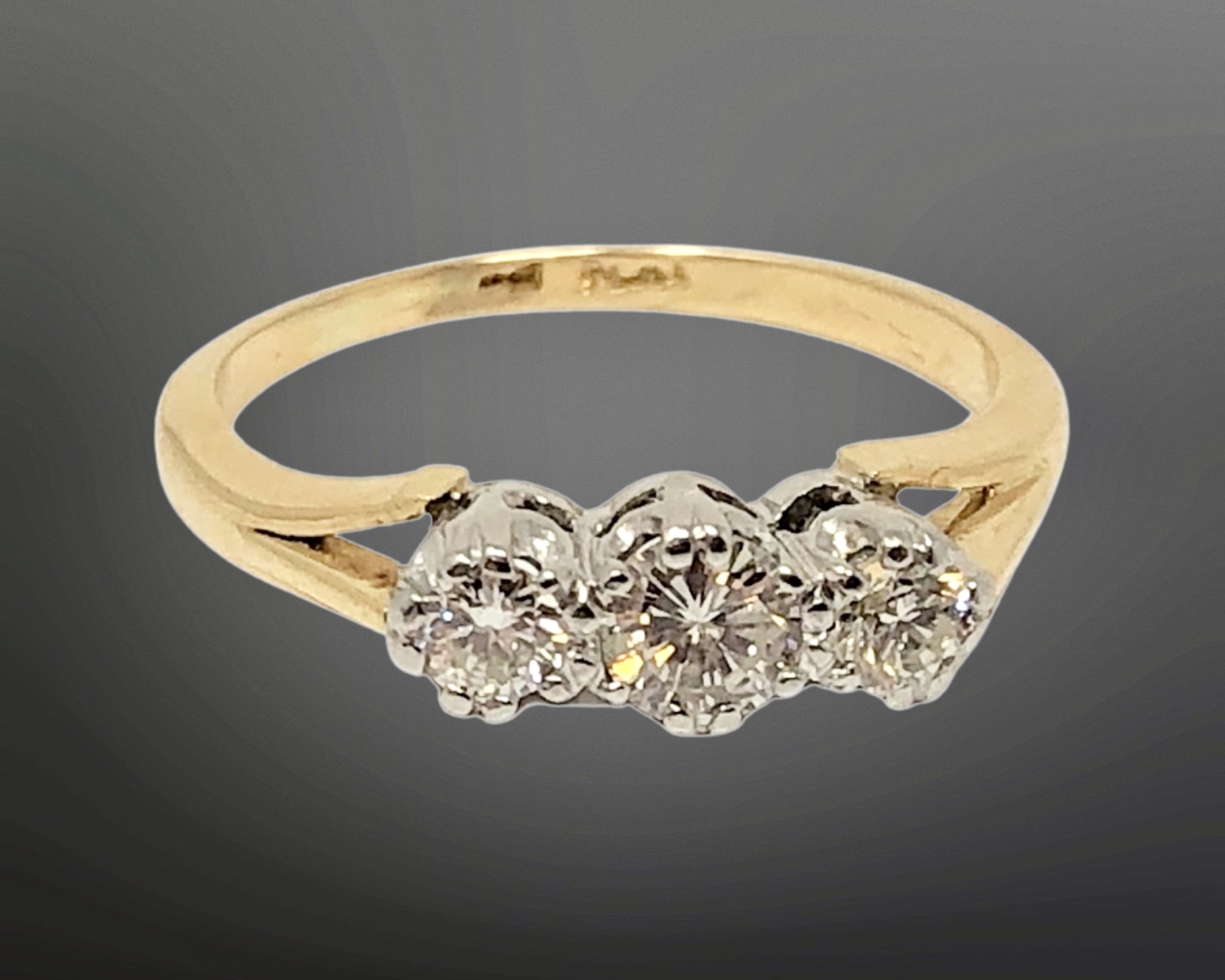 An antique 18ct gold platinum three stone diamond ring, size I CONDITION REPORT: 2.