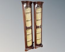 A pair of narrow reproduction corner display cabinets.