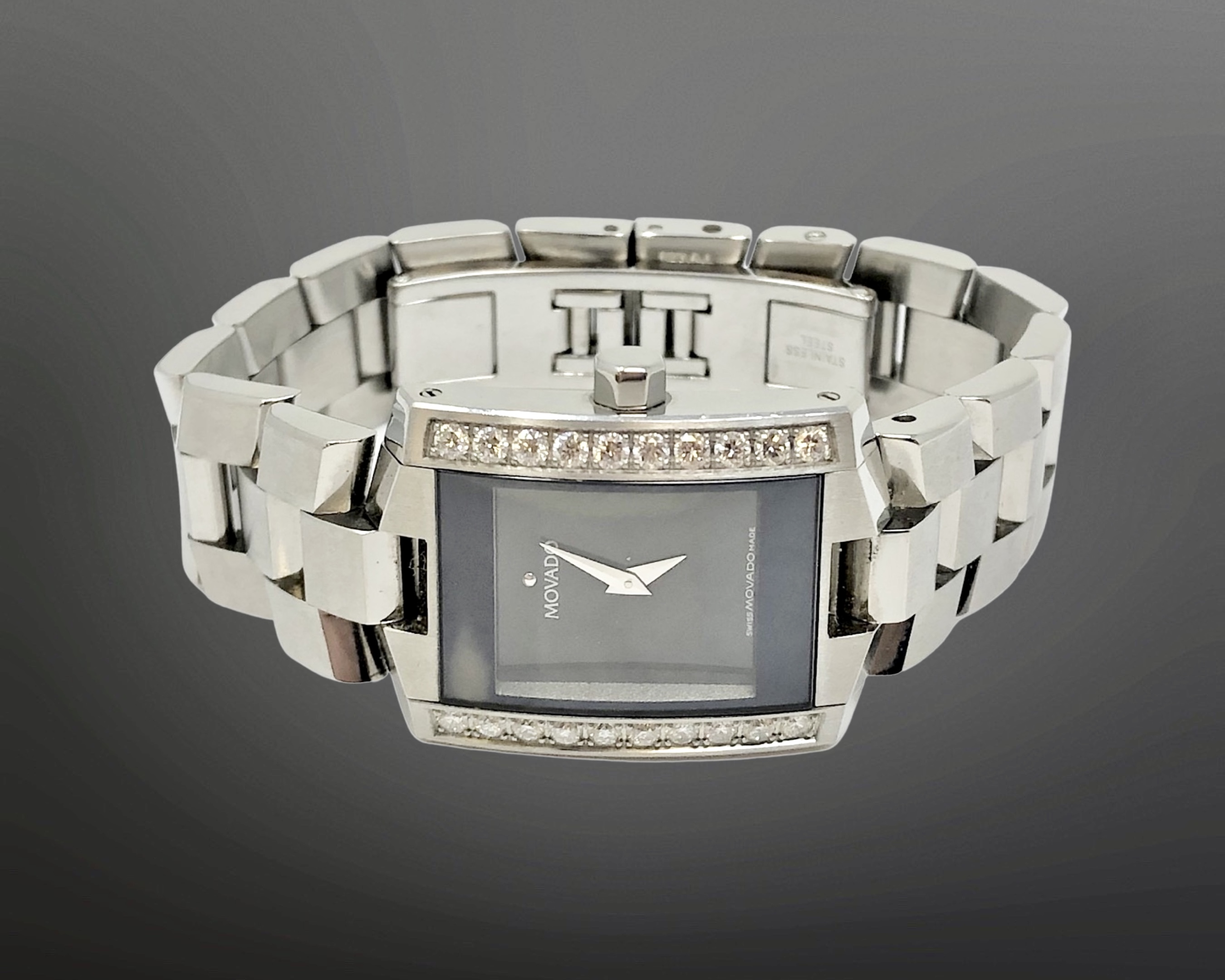 A stainless steel Movado wristwatch set with twenty diamonds, approx.