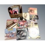 A box of vinyl records including mid century 45s, Iron Maiden, Black Sabbath, The Beatles,