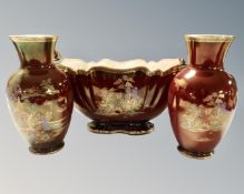 A Crown Devon Fieldings twin handled planter together with two further matching vases in an