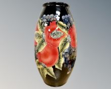 A Moorcroft style pomegranate pattern vase, bears printed signature, height 29.5cm.