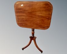 A 19th century mahogany tilt topped occasional table on three way pedestal.