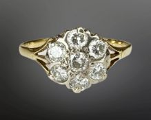 A yellow gold diamond cluster ring, shank unmarked, the total diamond weight estimated at 0.