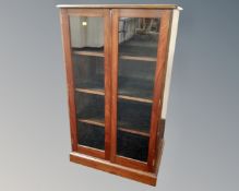 An Edwardian mahogany double door glazed cabinet.