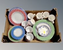 A box containing CreaTable dinnerware together with a pair of Japanese china coffee cups with
