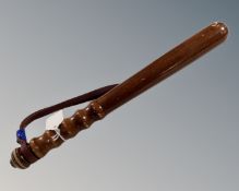 A wooden truncheon.
