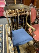A beech wood spindle back rocking chair.