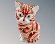 A Royal Crown Derby seated cat paperweight with silver stopper.