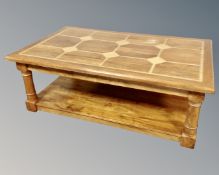 A Barker & Stonehouse rectangular two tier coffee table with travertine tile inlay.