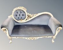 A contemporary Rococo style settee upholstered in a blue dralon fabric.