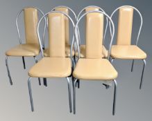A set of six tubular metal vinyl upholstered restaurant chairs.