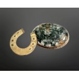 A 9ct gold horse shoe shaped brooch and a further brooch in 9ct gold mount