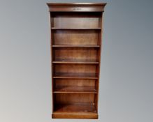 A set of reproduction mahogany open bookshelves.
