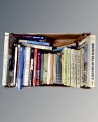 A box containing books relating to model engineering, Formula 1 and other motor racing.