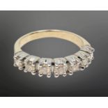 An 18ct white gold seven stone diamond half eternity ring, approximately 0.7ct, size P.