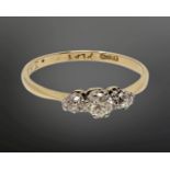 An 18ct gold three stone diamond ring, size O CONDITION REPORT: 1.