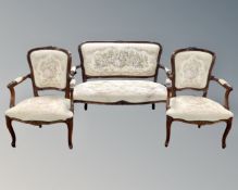 A French style three piece salon lounge suite upholstered in a tapestry fabric.