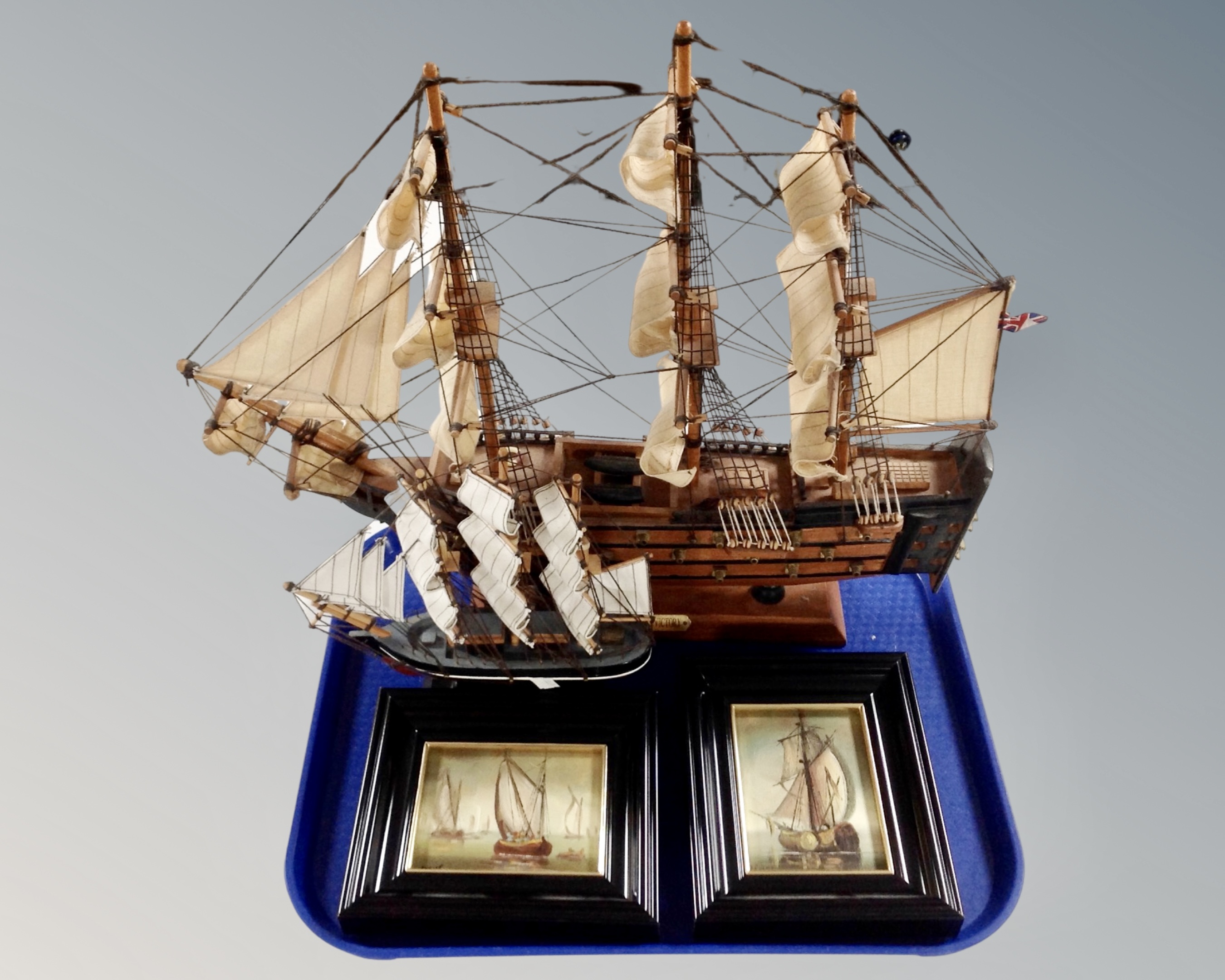 Two wooden models of the Cutty Sark and HMS Victory,