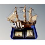 Two wooden models of the Cutty Sark and HMS Victory,