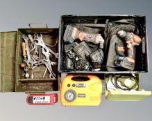 A crate containing Von Haus power tools with batteries and chargers,