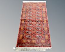 A machine made Tekke design carpet.