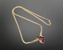 An 18ct gold ruby and diamond necklace, 12.45g. CONDITION REPORT: Chain length 42 cm.