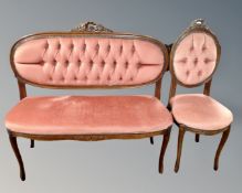 A four piece stained beech framed salon suite upholstered in pink button dralon comprising of two