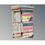 A box of vintage books, folded maps,