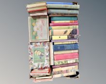 A box of vintage books, folded maps,