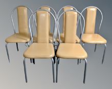 A set of six tubular metal vinyl upholstered restaurant chairs.