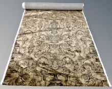 A roll of brown velvet fabric with classical motif.