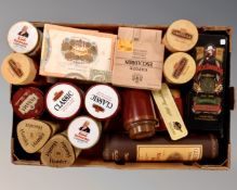 A box containing a quantity of whiskey and cigar tins and cigar boxes.